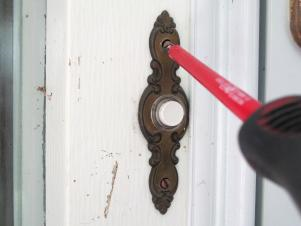 Unscrewing the doorbell