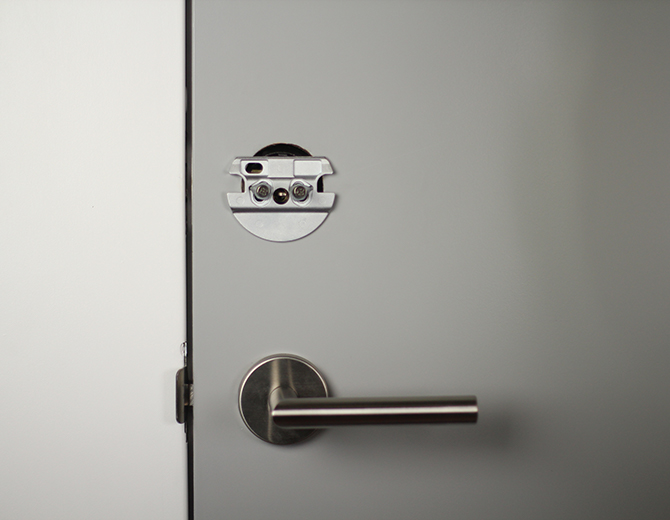 Fastening the smart lock mounting plate. Illustration.
