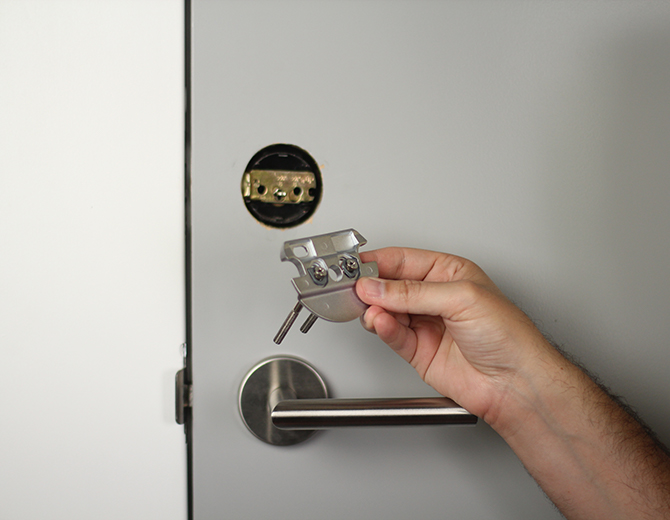 Placing the smart lock mounting plate. Illustration.