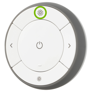 Brightness increase button highlighted on remote control.