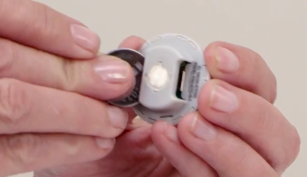 Battery being replaced in dimmer.