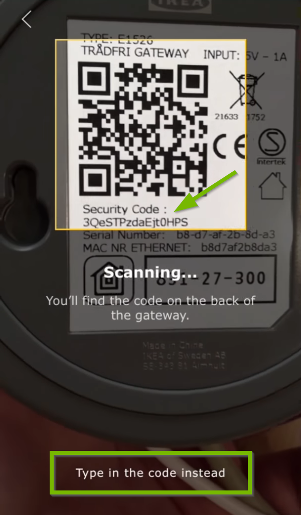 Security code pointed out on bottom of gateway and Type in code instead option highlighted in Ikea Tradfri app.