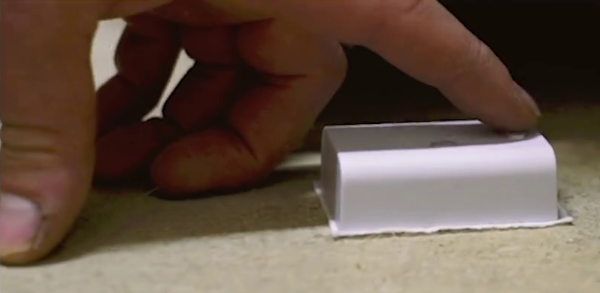 Person touching Wally sensor button