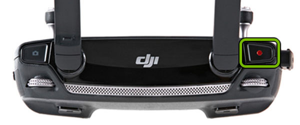 Record button highlighted on left shoulder of remote control.