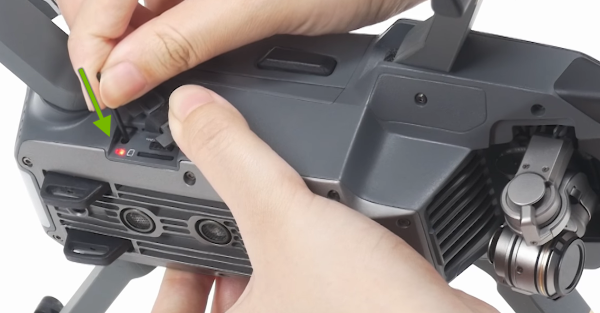 Link button being pressed on right side of drone.