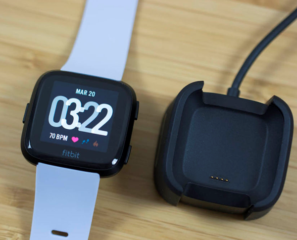 The charging cradle and the versa showing the pins