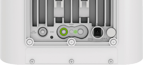 Sync button highlighted on rear of Orbi Outdoor Satellite.