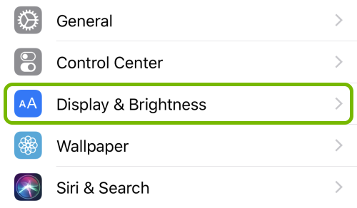 Display & Brightness option highlighted in iOS Settings.