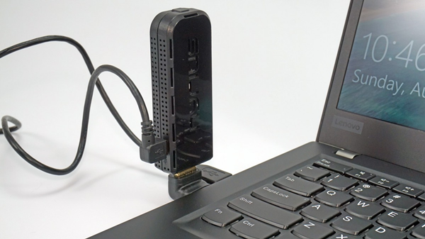A wireless hdmi transmitter plugged into a laptop