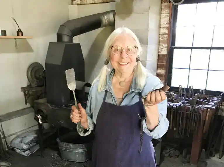 A picture of a tradeswoman working in one of the Kilts Farm workshops.