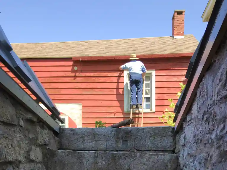 An image of a man working on the Red House at Kilts Farm.