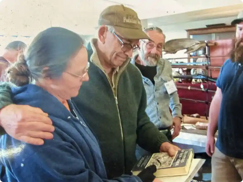 An image of Skip Barshied sharing with others at an event.