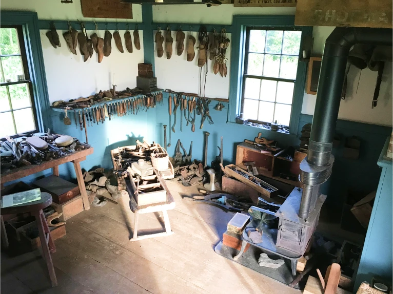 A picture inside the shoe shop with all of the tools and different equipment.
