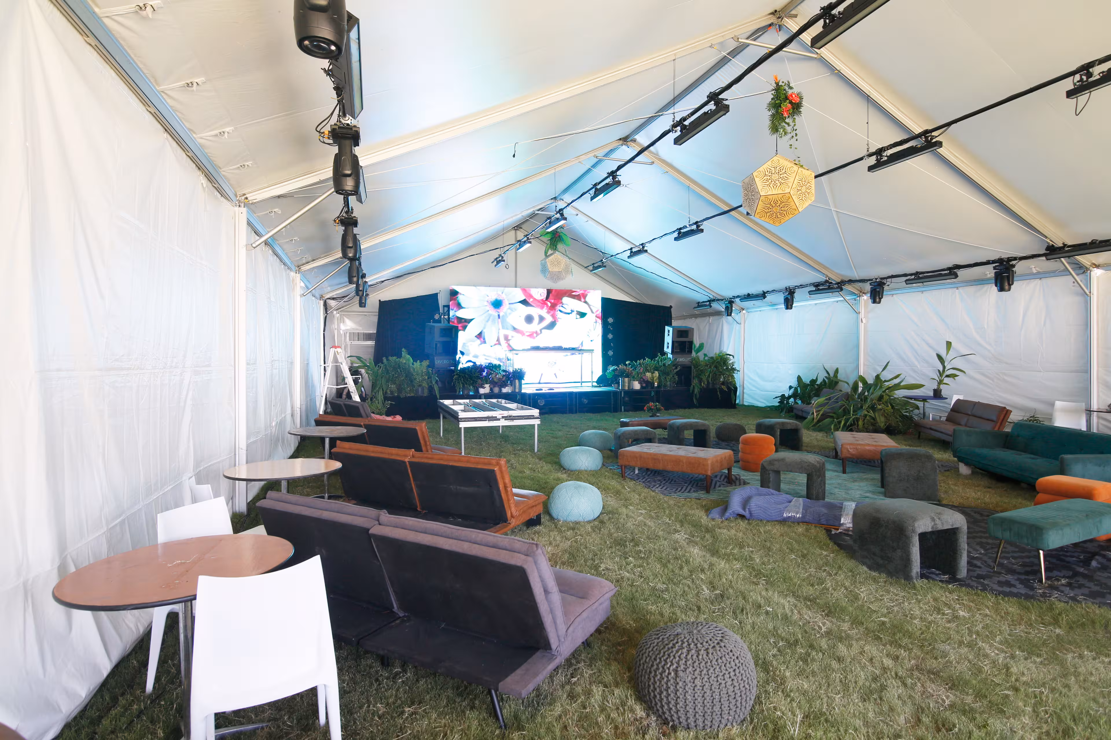 Speaker stage setup underneath a tent provided by Grand Tents & Events at the Deep Tropics Festival in 2025