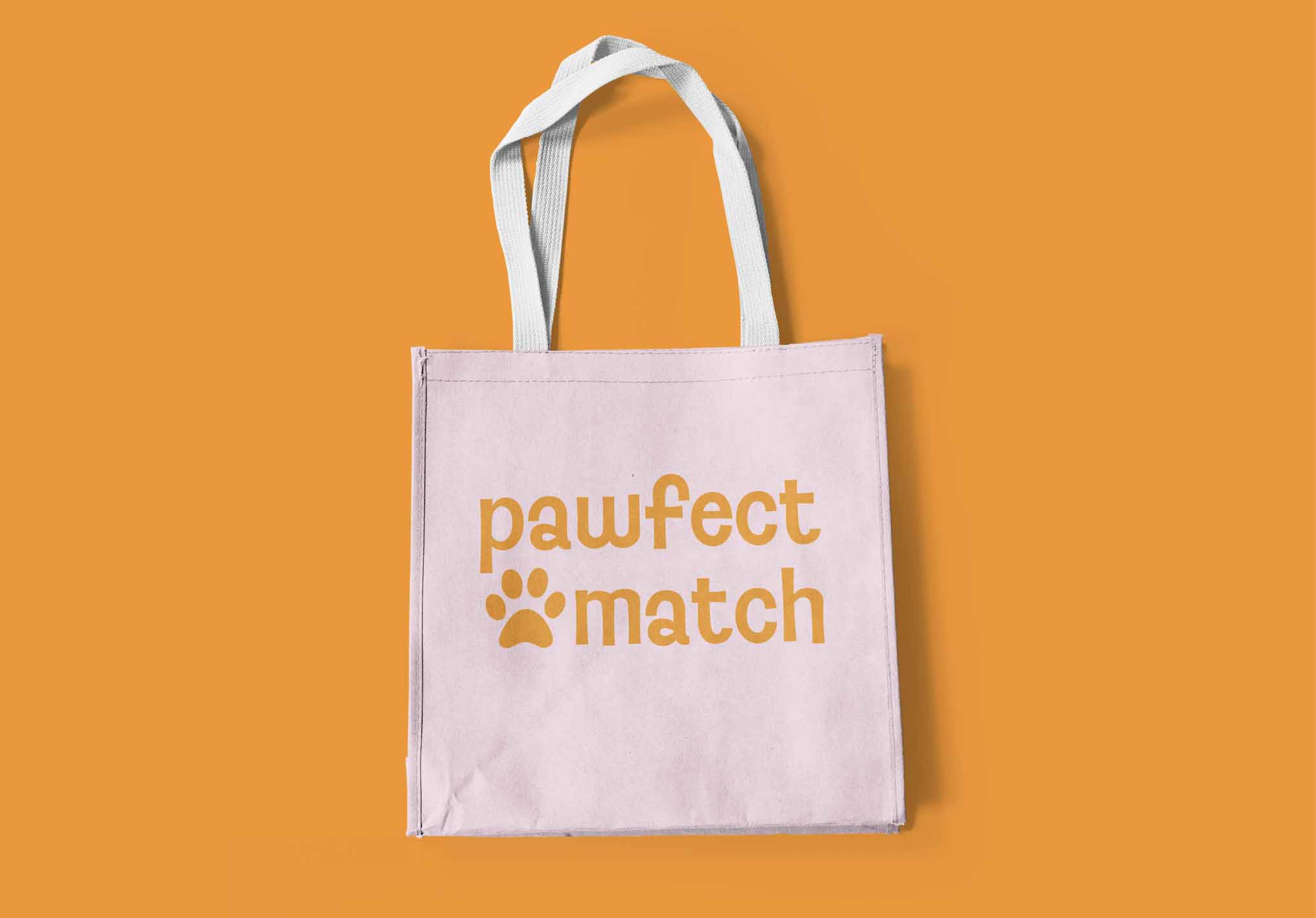 Pink tote bag with pawfect match text 