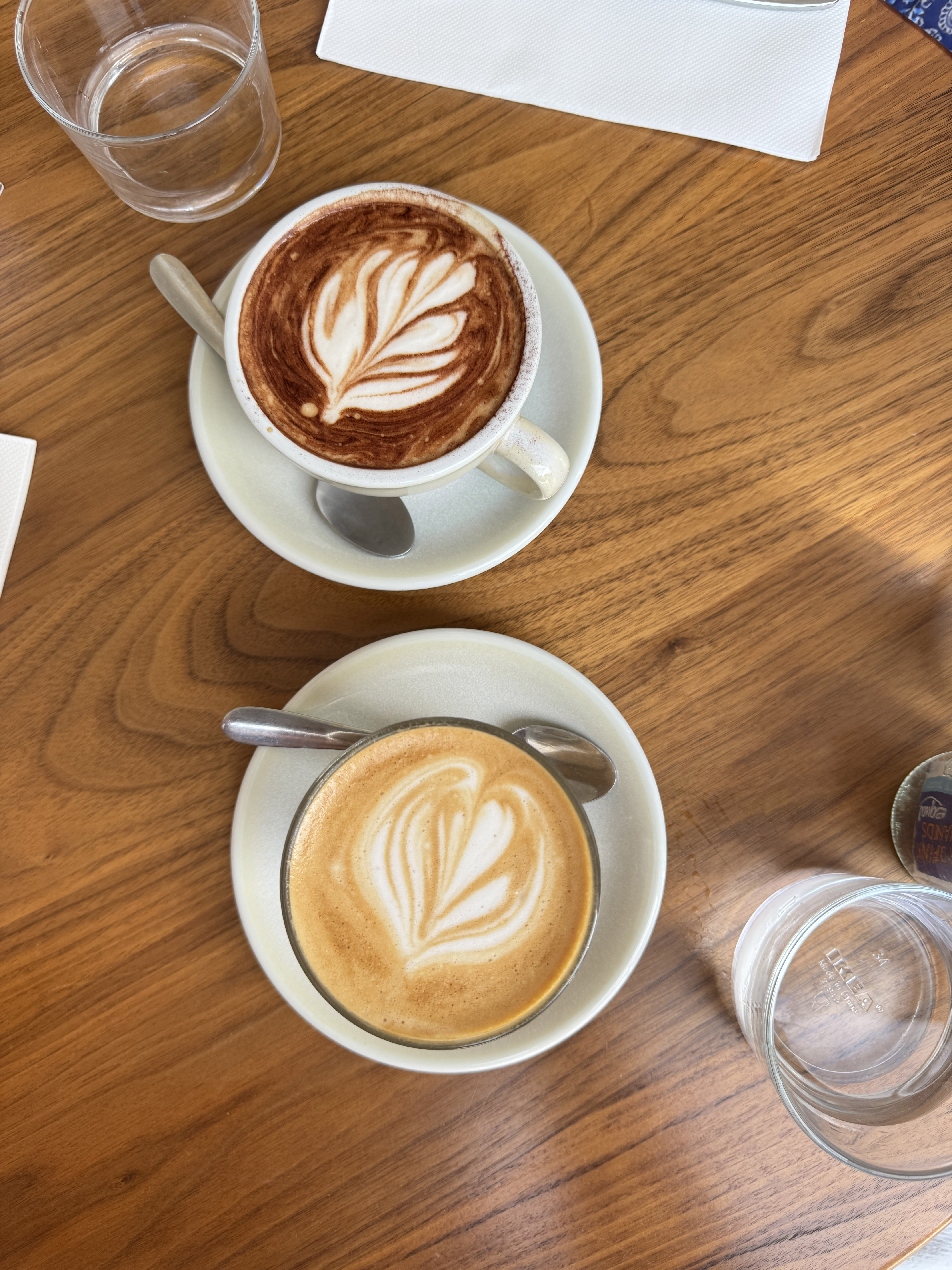 Two coffee's on wooden table 