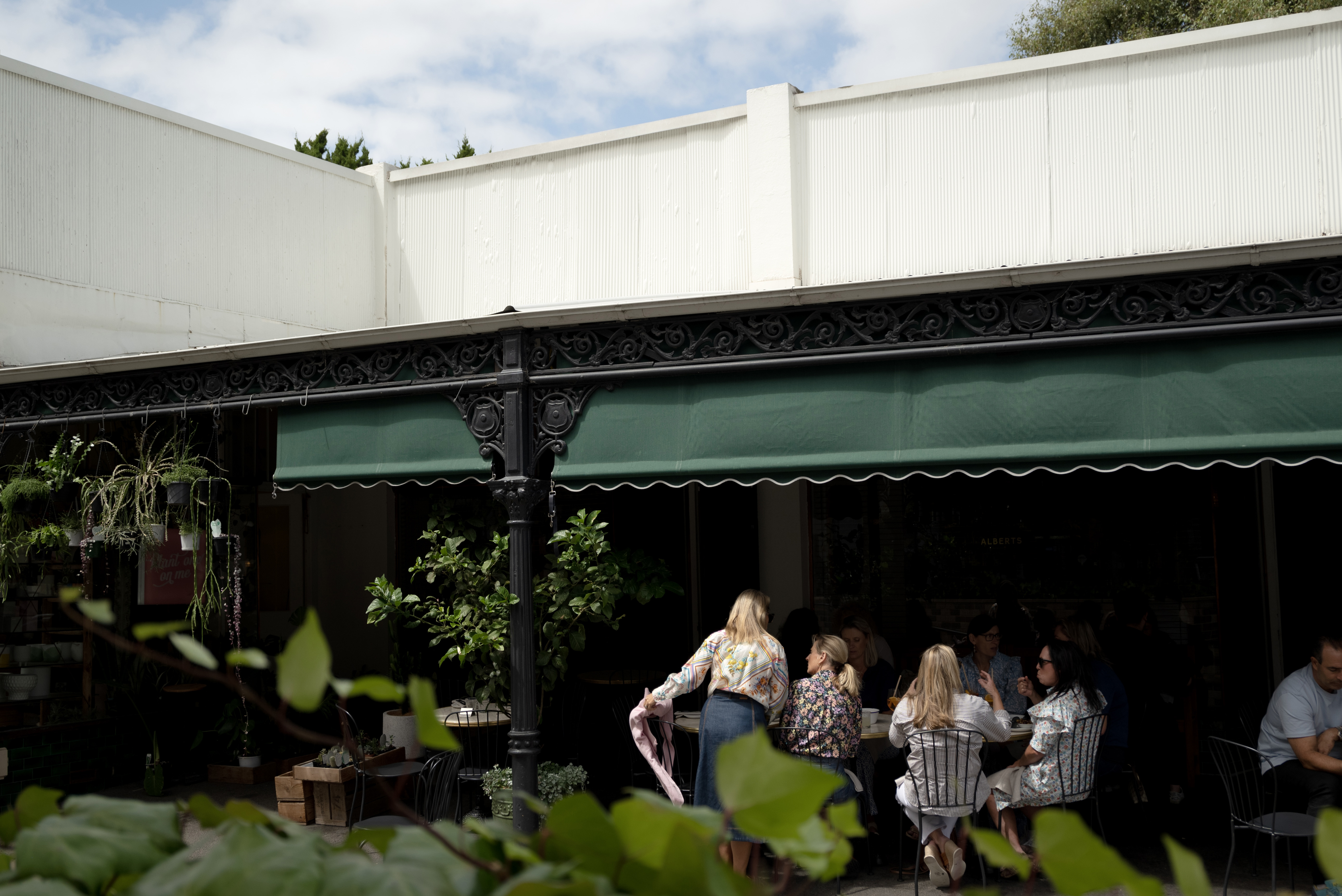 Women sitting outside a wine bar 