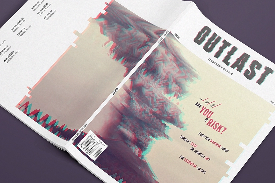 Outlast magazine cover and back cover face down on muted purple background.