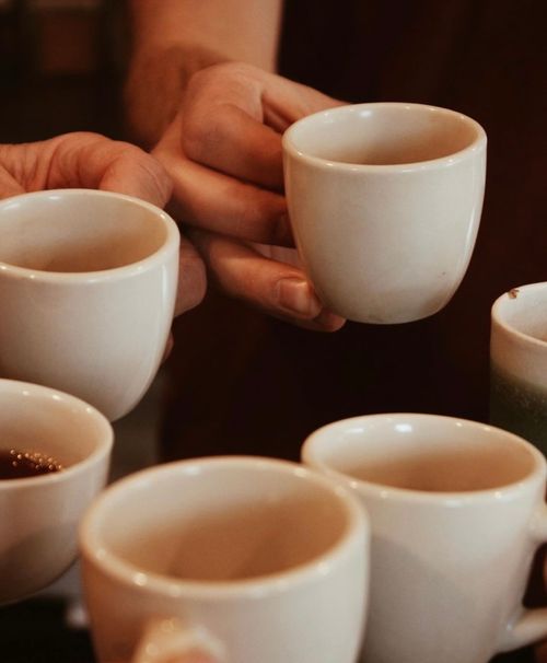 Coffee cheers at Beantrust Coffeebar — capturing the spirit of togetherness and warmth by Studio Wisdom