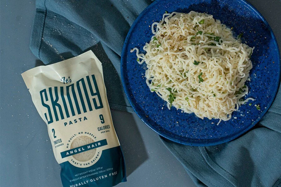 It’s Skinny Pasta angel hair pouch and plated gluten-free pasta meal with herbs, part of brand packaging system created by Studio Wisdom