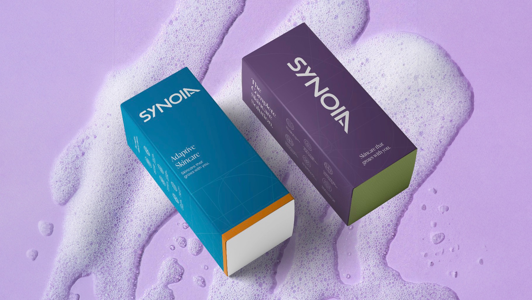 Synoia Technologies adaptive skincare packaging design with bold brand colors, created by Studio Wisdom.