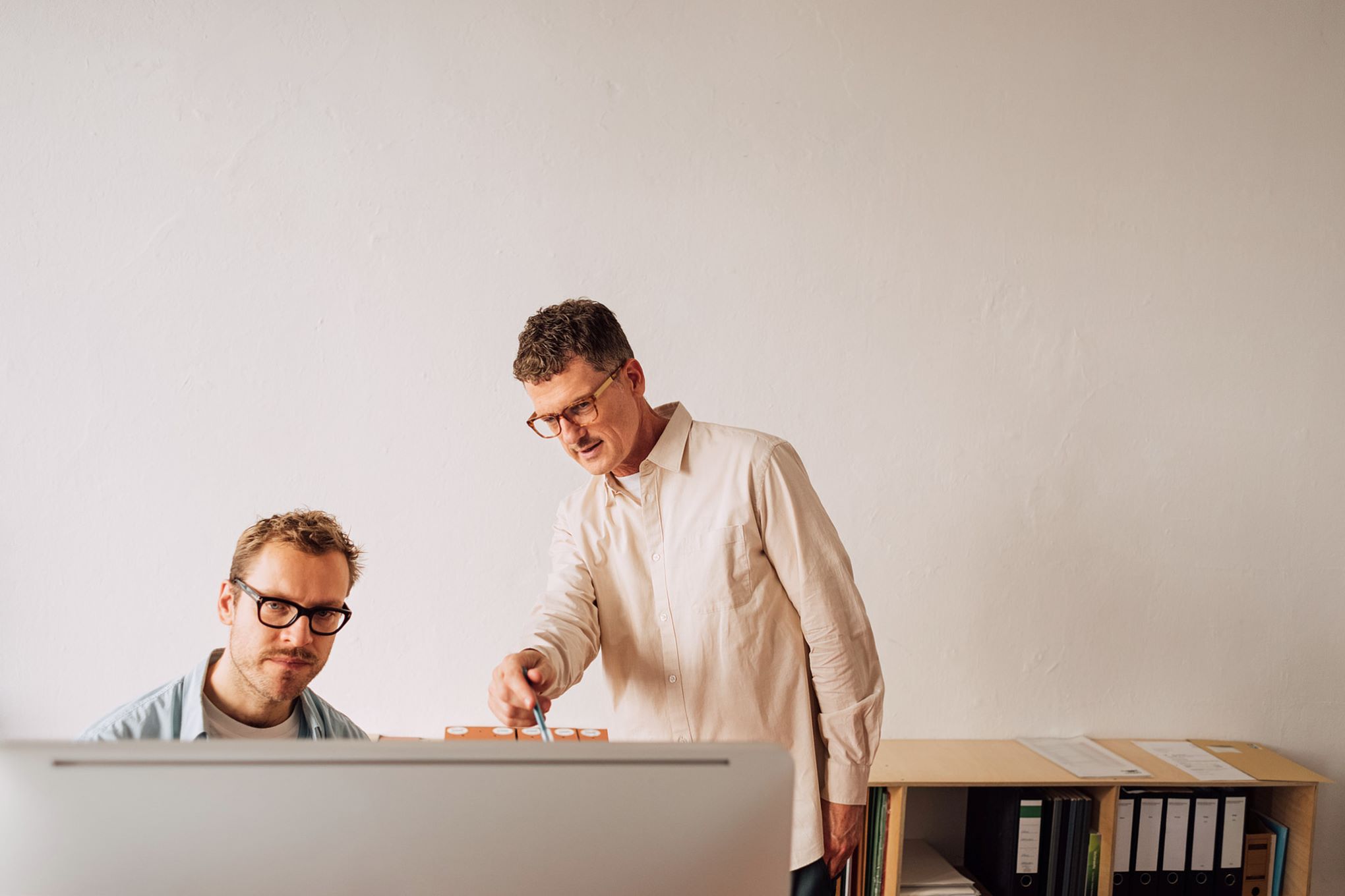 Photo of a man looking seriously at his computer screen.