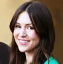 A young woman smiling