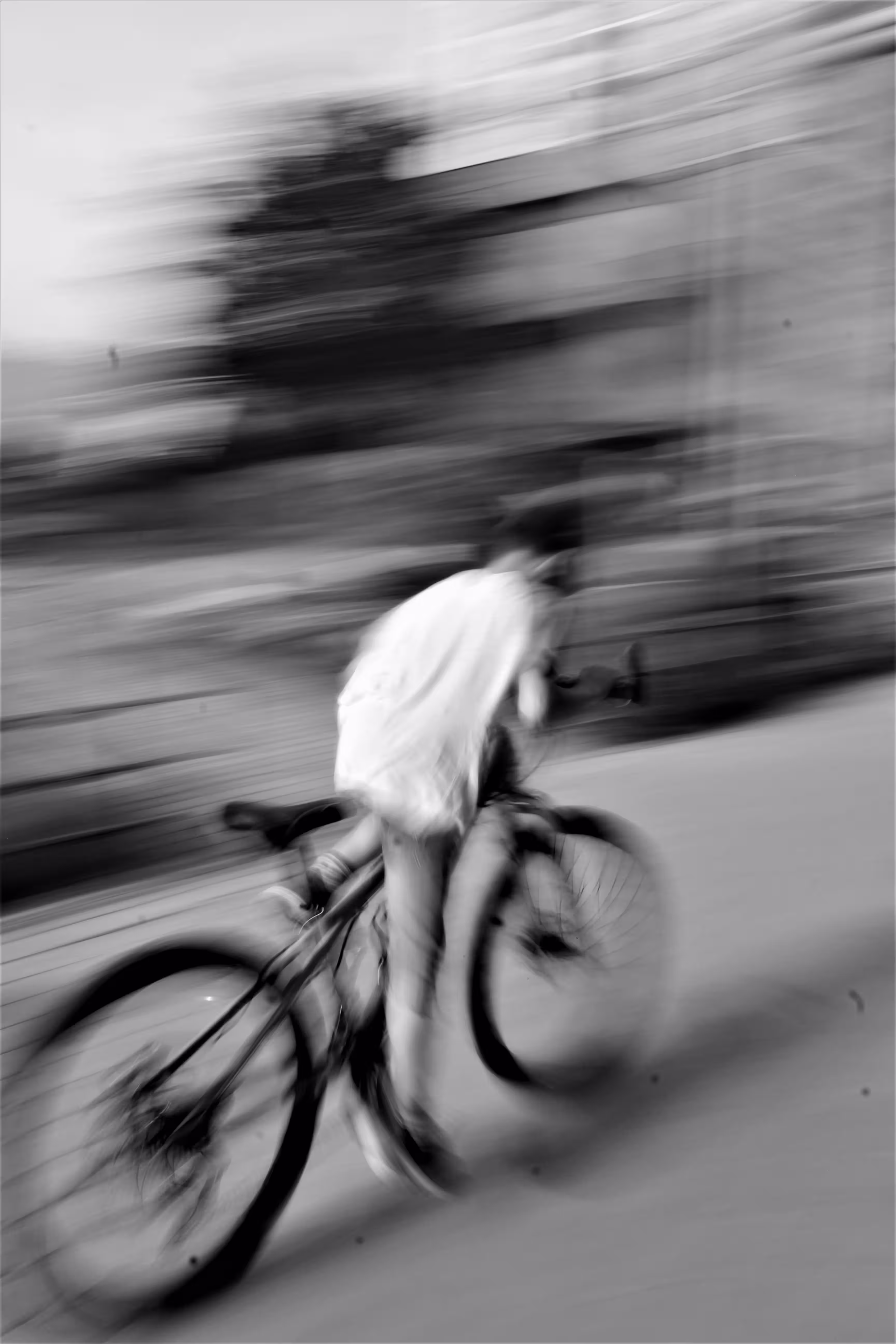 Grayscale Photography of Person Riding Bicycle.
