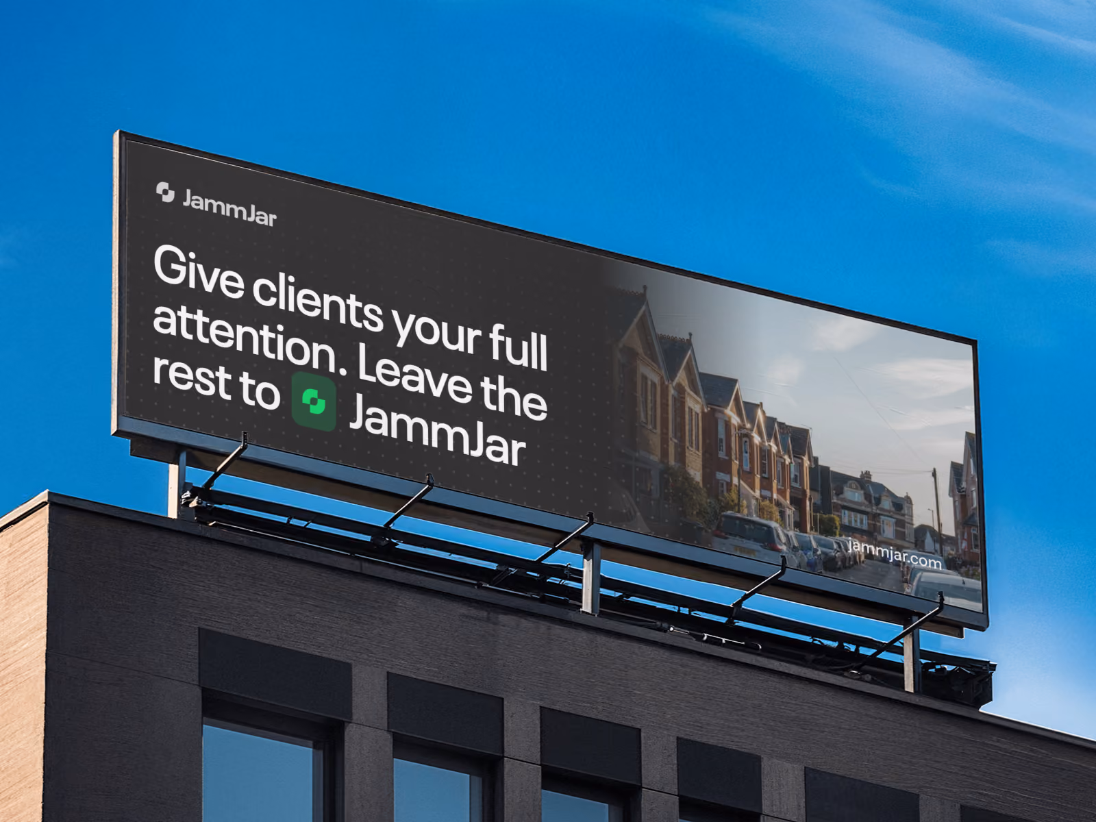 JammJar billboard on a city rooftop reading 'Give clients your full attention. Leave the rest to JammJar'