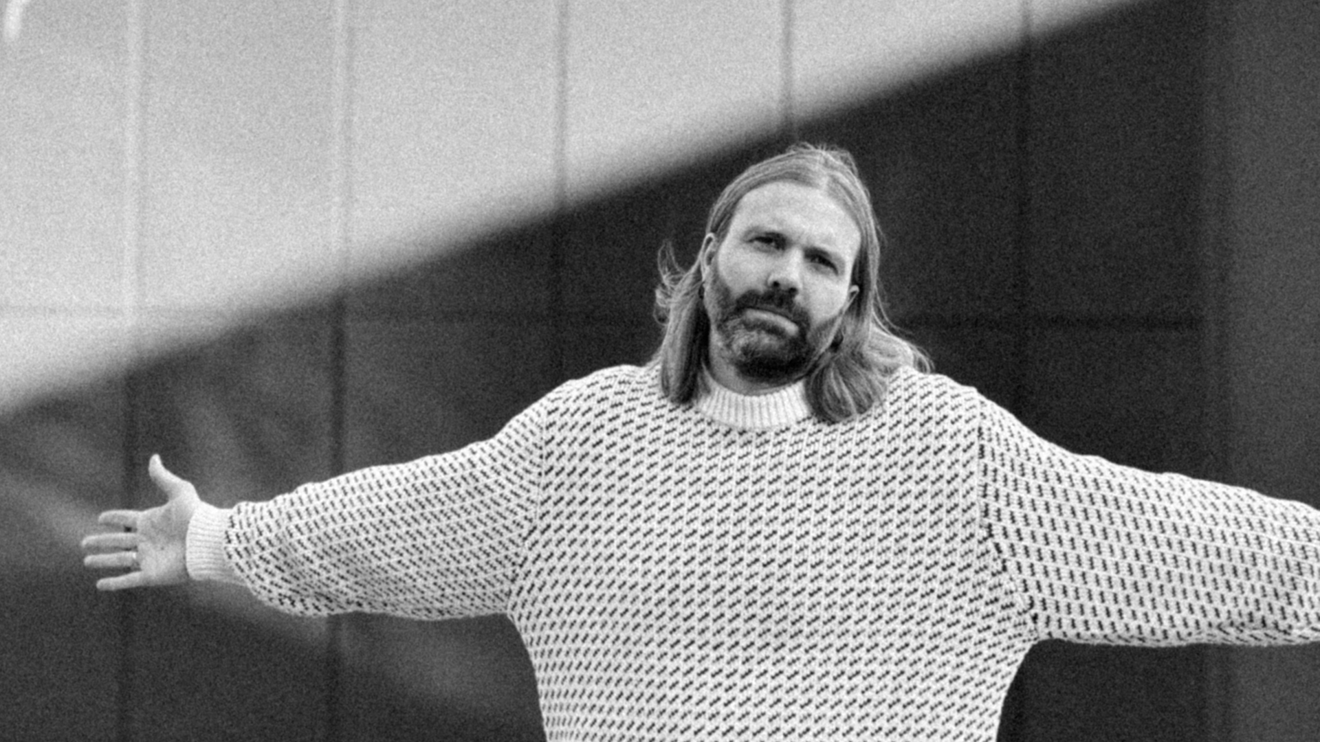 The boss reaching out his arms like a total boss, or like jesus