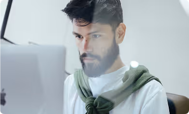 Man on the phone with white shirt sitting on office chair