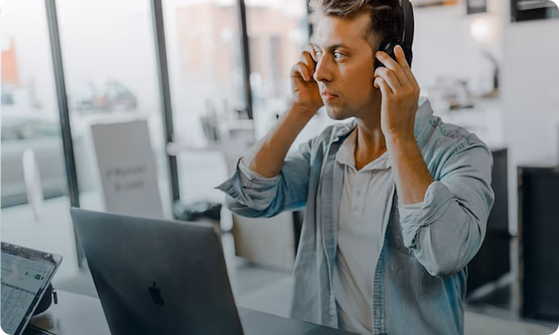 People at the office discussing in front of computers