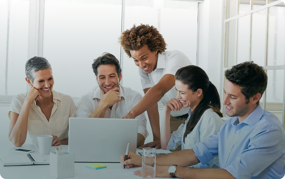 Man talking with hands at a reunion in front of a team