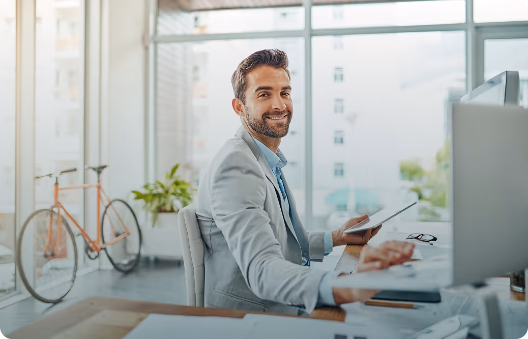 Cup of coffee, notebook and open laptop on a coffe table