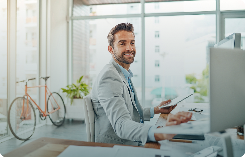 Cup of coffee, notebook and open laptop on a coffe table