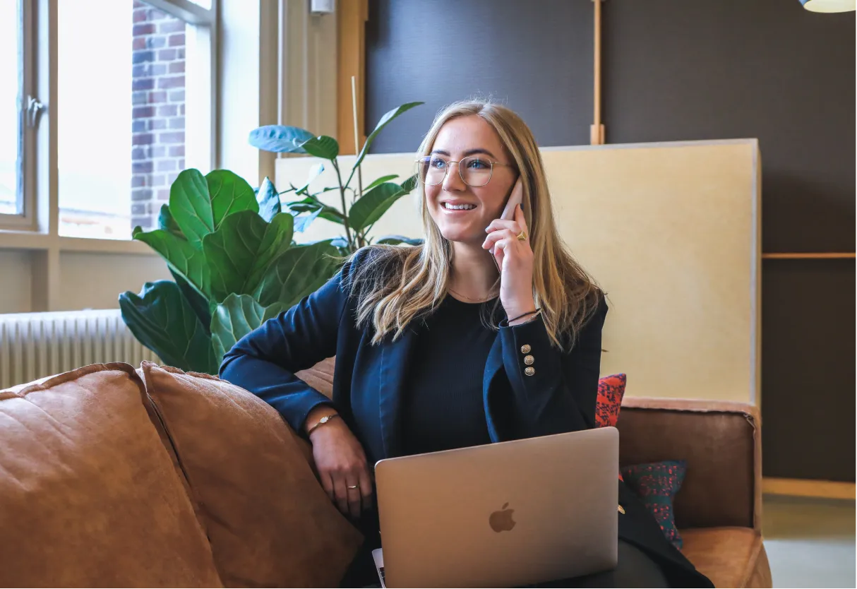 Lady on couch calling someone