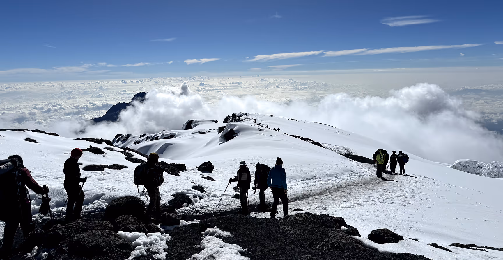 Climbers on the snowy peaks of Kilimanjaro