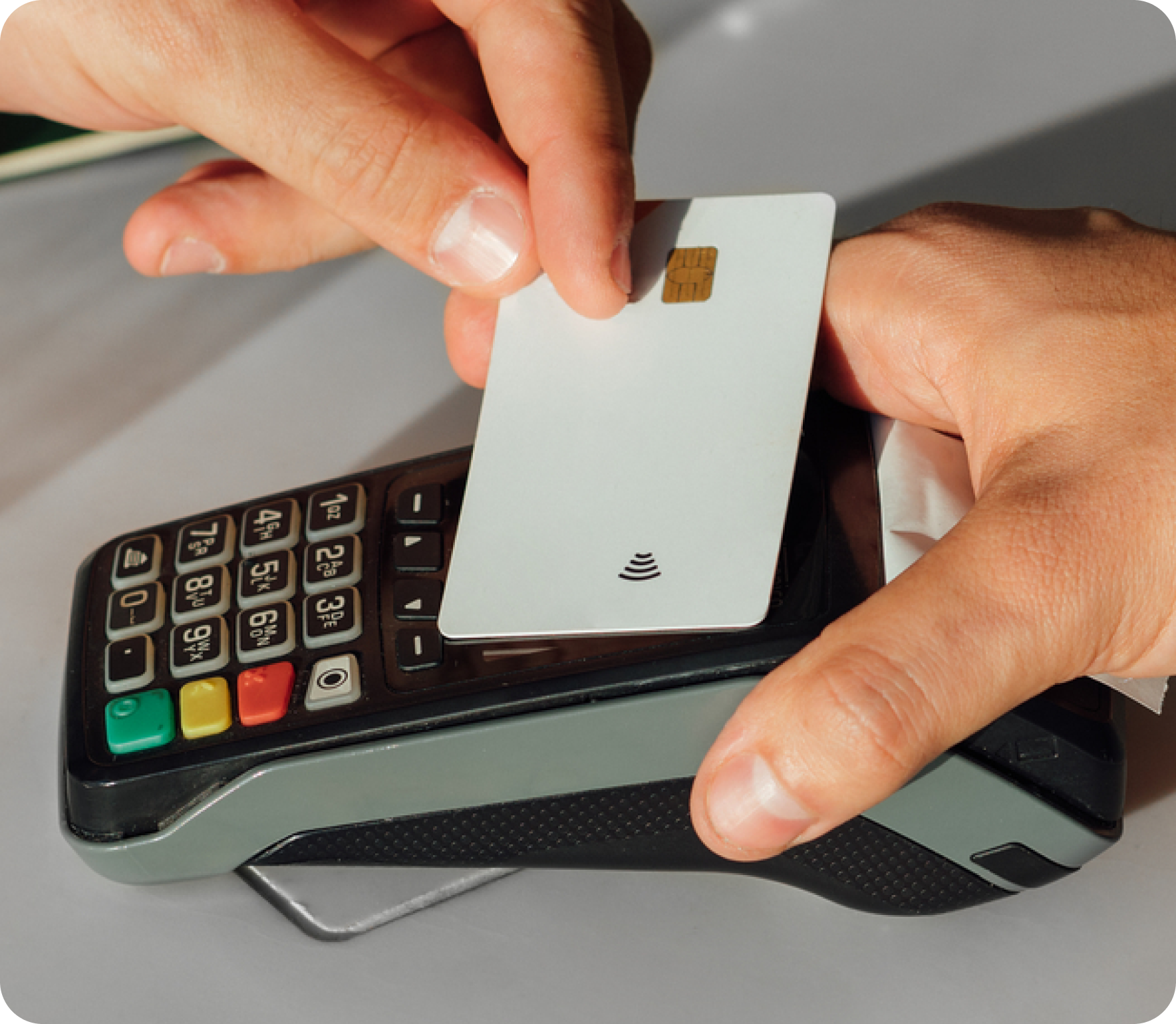 Customer tapping a payment card on a terminal