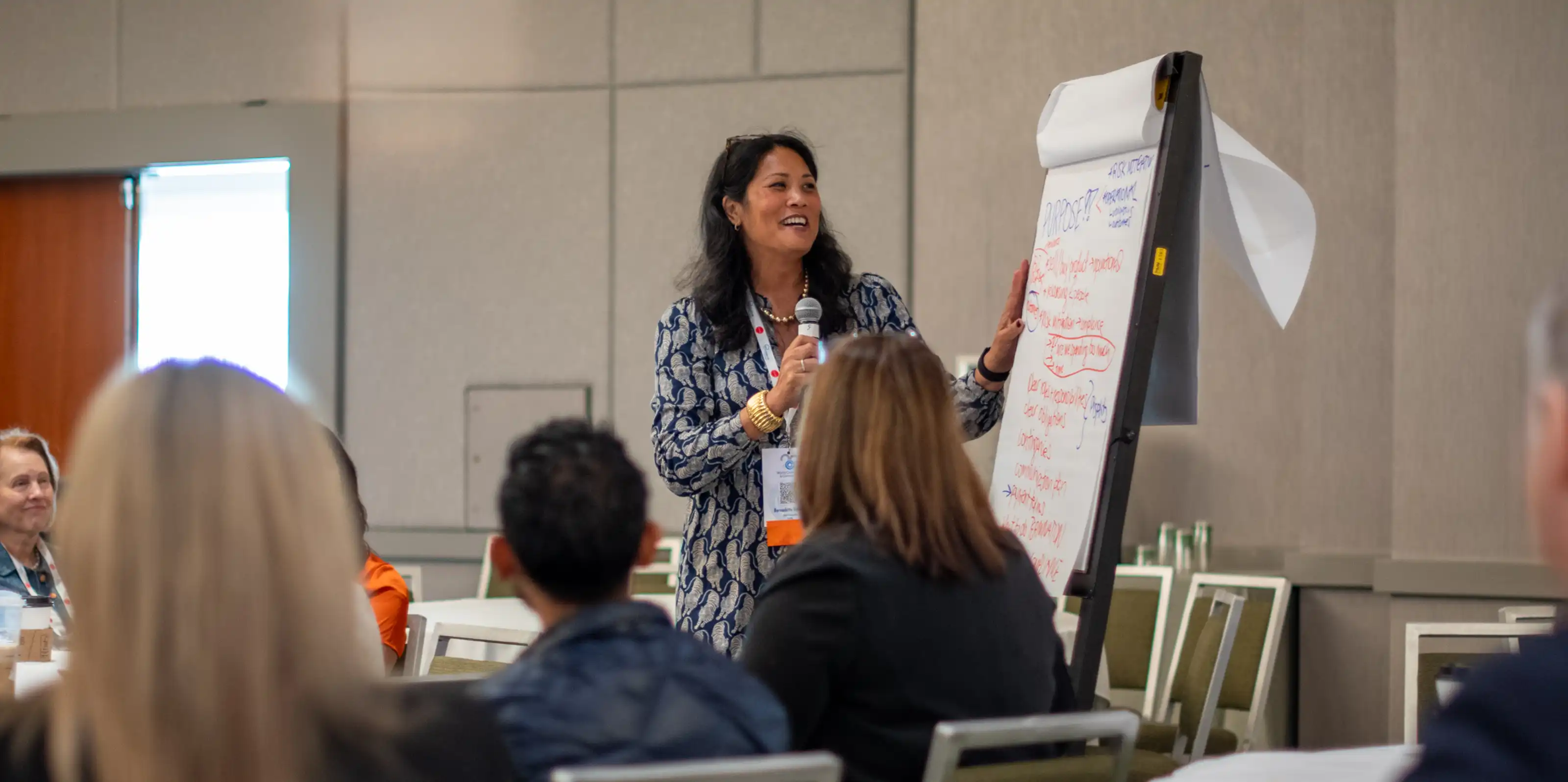 Female speaker at conference workshop