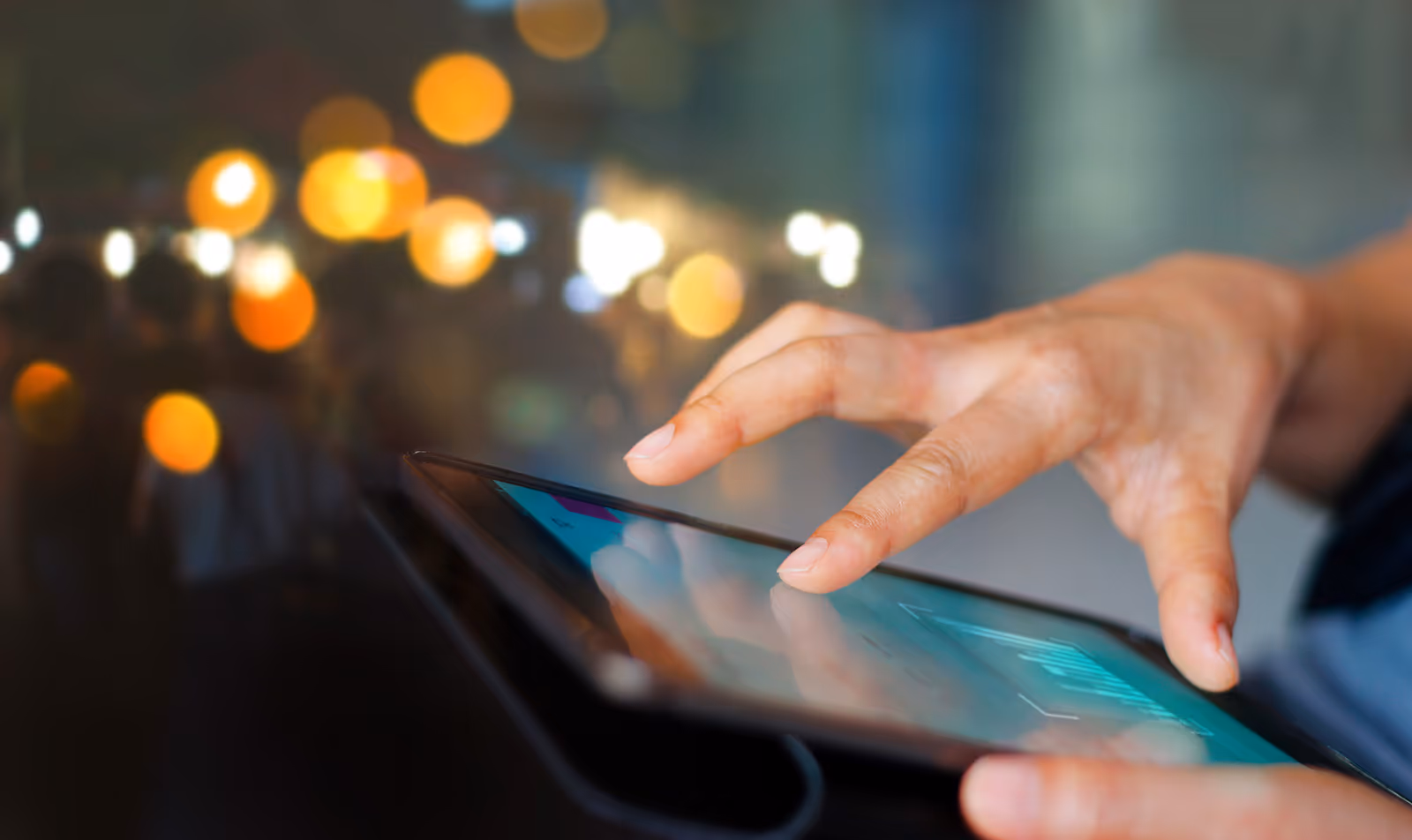 Hand interacting with touch screen device
