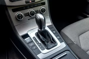 Modern automatic transmission gear selector in a luxury car dashboard.
