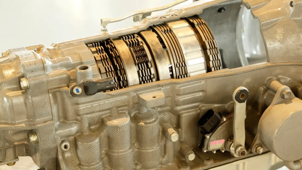 Detailed view of an automatic transmission housing with clutch plates and internal components