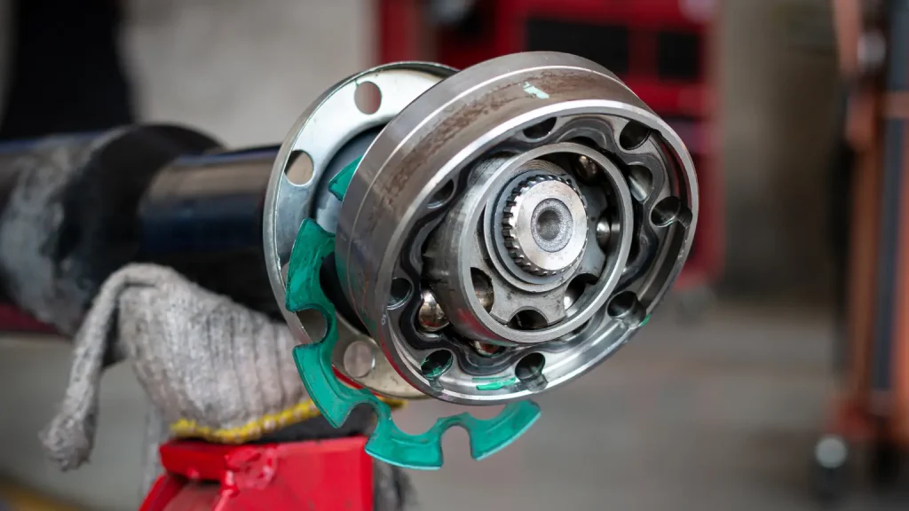 How CVTs work illustrated with a close-up of a belt and pulley system in a transmission