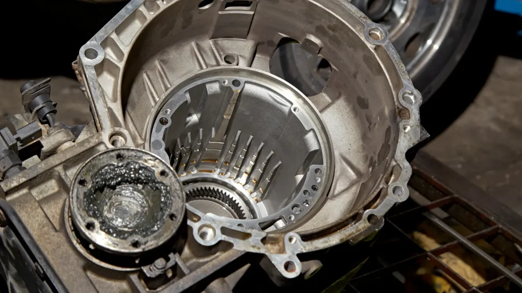 Opened transmission case revealing inner mechanics, used for automatic transmission repair and maintenance