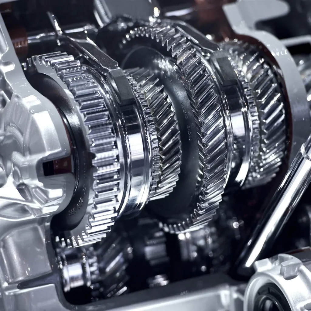 Local transmission shops can diagnose and repair issues shown in this close-up of shiny metal transmission gears