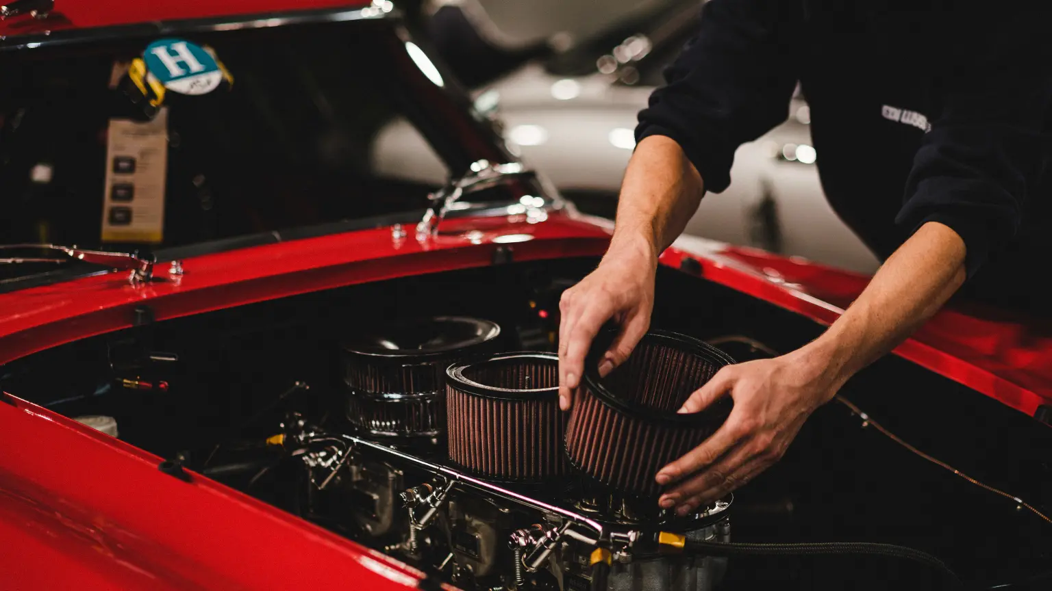 Transmission mechanic shops performing classic car maintenance with a focus on air filter replacement.