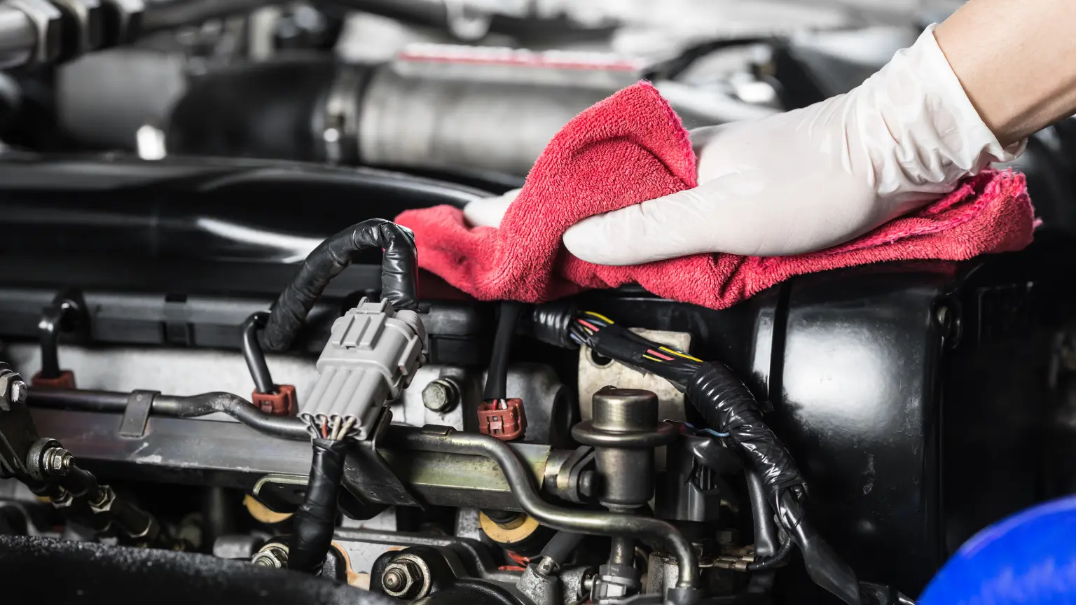 Transmission rebuild parts visible inside a clean engine bay with connectors, hoses, and electronic components.