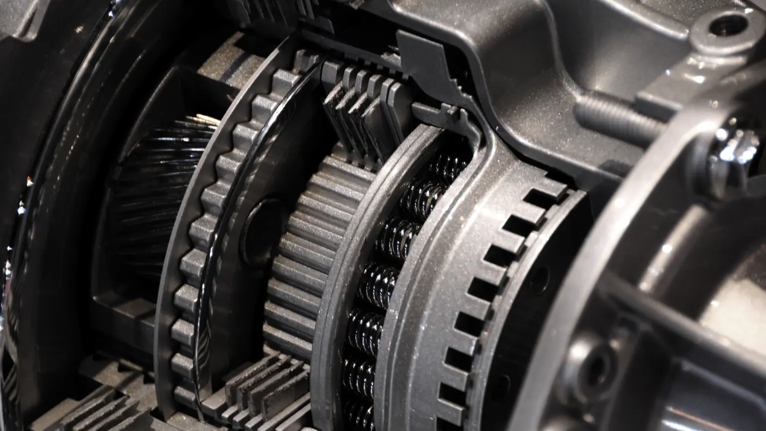 Dual-clutch transmission close-up showing interlocking gear components and spring-loaded clutch assemblies.