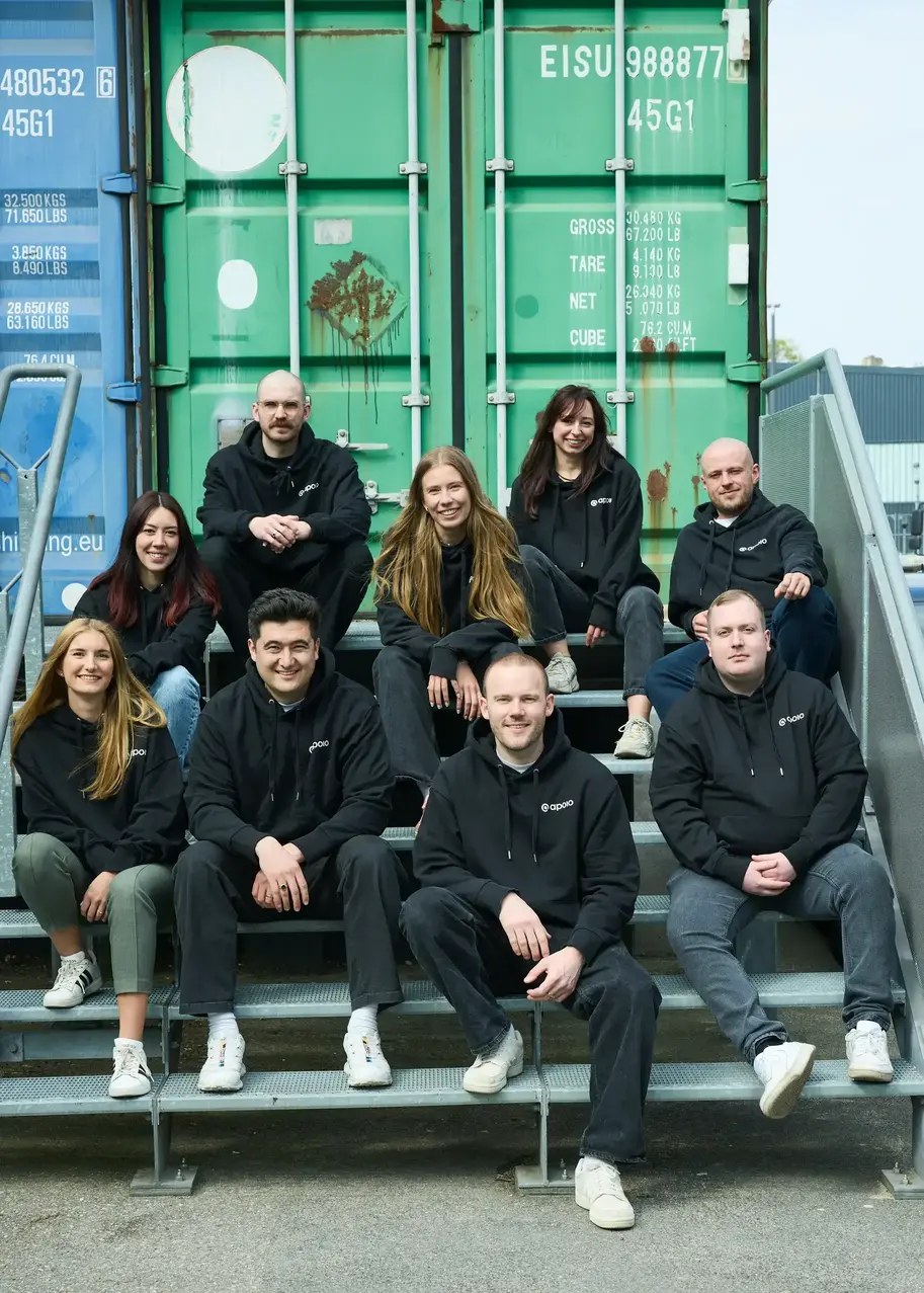 apoio team sitting on stairs