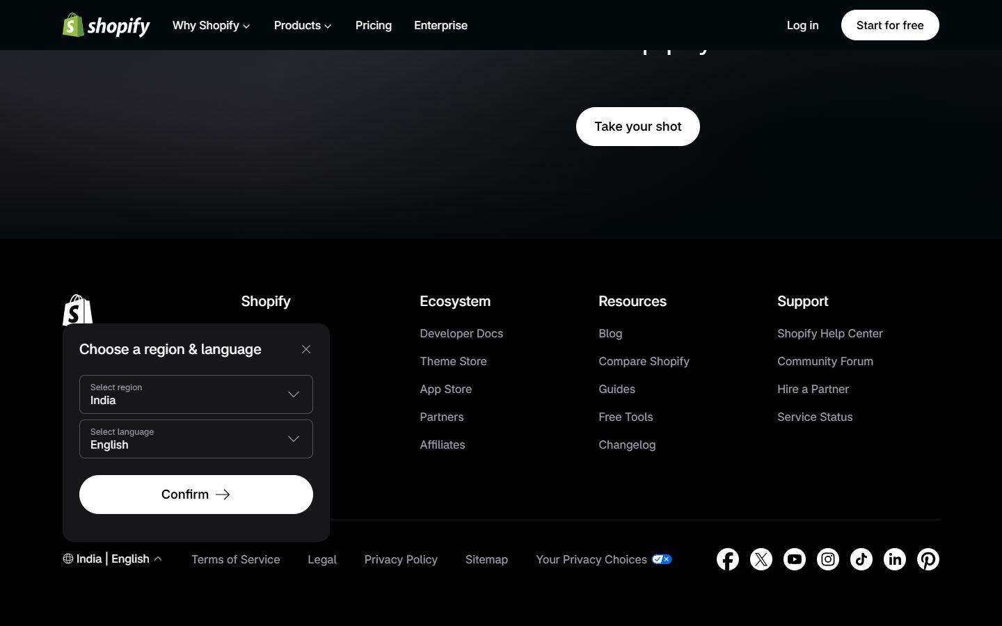 Shopify footer with the Choose a region and language selector open as a native popover